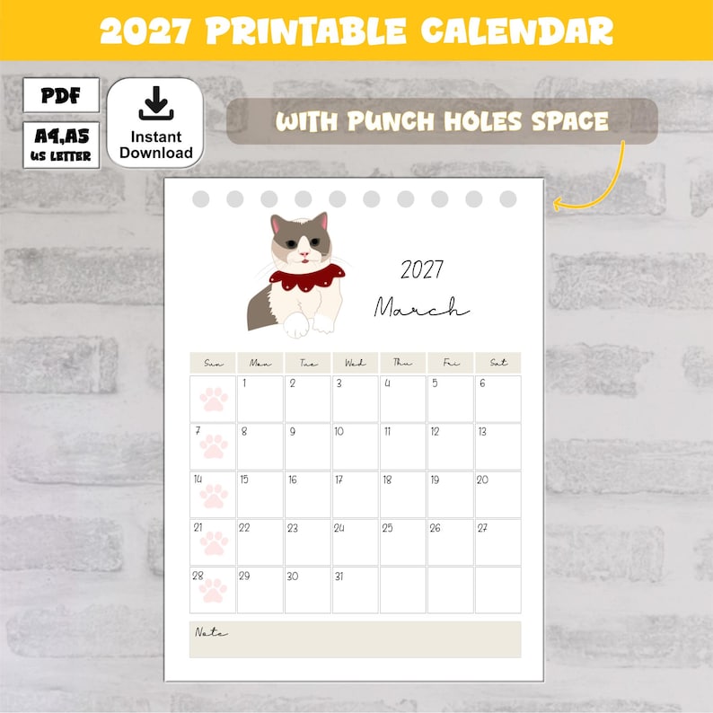 May include: A 2027 printable calendar page for March featuring a white and gray cat wearing a red collar with white dots. The calendar grid includes dates 1 through 31, light pink paw print icons, and a note section at the bottom. The design includes space for punch holes at the top and text indicating PDF, A4, A5, and US Letter formats.