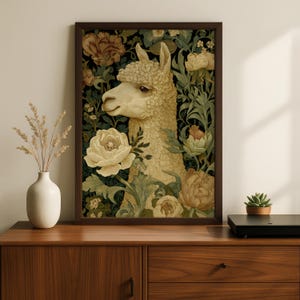 May include: A framed wall art print featuring a cream-colored llama surrounded by detailed illustrations of large beige and white flowers and green foliage against a dark background. The artwork is enclosed in a simple dark brown wooden frame.