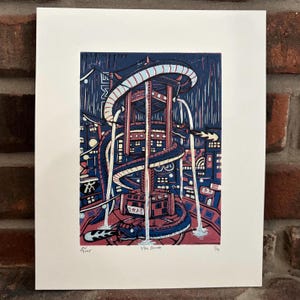 May include: A colorful print featuring a stylized cityscape with a large, serpentine structure. The artwork uses shades of blue, red, and white, with the text "99th Street" at the bottom. The print is on white paper.