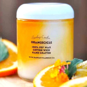 one hundred percent soy wax, hand crafted, cotton wick, eight ounce, orange scented candle.
