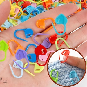 May include: A white ceramic mug with a black handle and the text "But First, Coffee" in a bold, black font. The mug is set against a neutral background, highlighting its simple design.