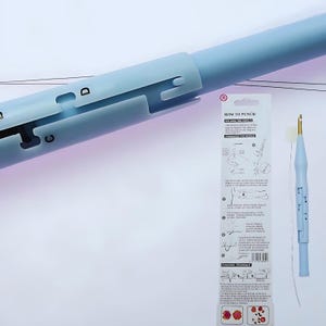 May include: A light blue plastic tool for punching holes in fabric, with a needle and instructions on how to use it. The instructions include illustrations and text that says "How to Punch" and "Punching Technique".