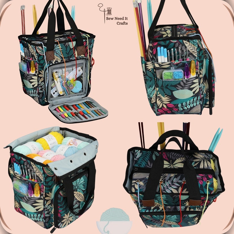 May include: A black and green tote bag with a floral pattern and multiple pockets. The bag is open and filled with yarn, knitting needles, and crochet hooks. The bag has a zipper closure and a handle. The bag is labeled "Sew Need It Crafts".