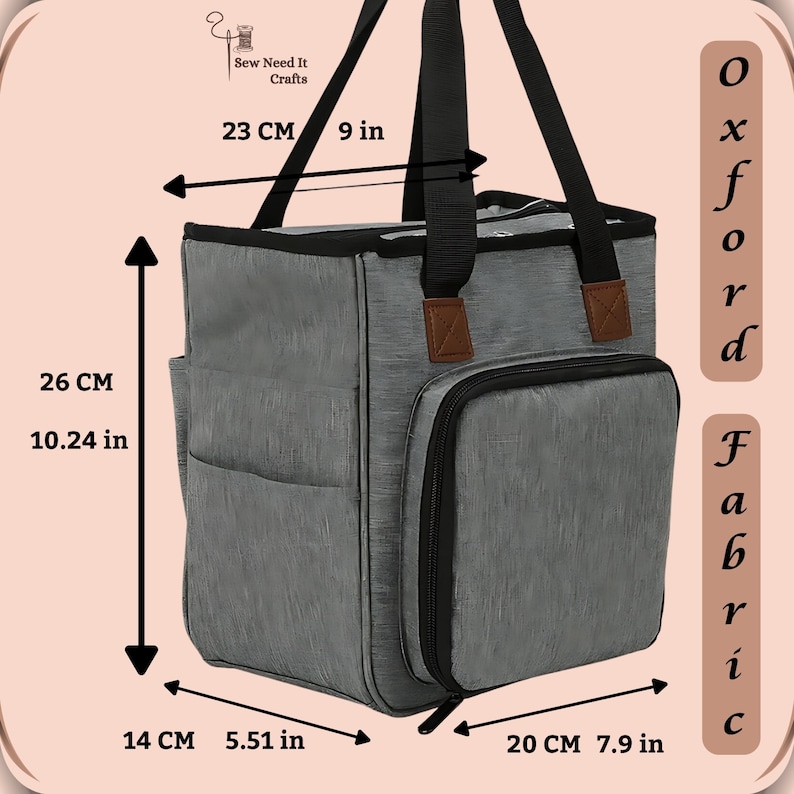 May include: Gray fabric tote bag with black handles and a zippered pocket on the side. The bag measures 9 inches wide, 10.24 inches tall, and 7.9 inches deep. The bag is labeled "Oxford Fabric".