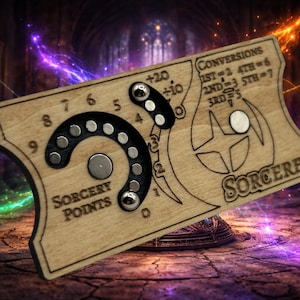 May include: Wooden Sorcerer's game board with a curved Sorcery Points dial and conversion chart. The board has a light wood finish with black and silver accents. The word "SORCERER" is printed on the board.