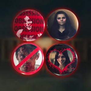 May include: Four circular pin-back buttons featuring photographic imagery. One button has red text reading OBSESSION repeatedly over a face. Another shows a person with pink cheeks. A third displays a person with a red slash. The fourth shows a person inside a red heart.