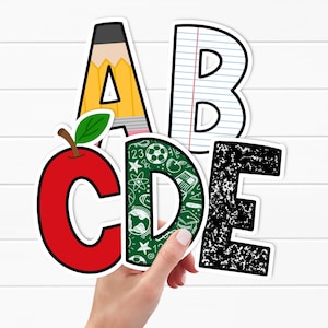 May include: Colorful alphabet letters with various designs, including a pencil, apple, and notebook paper. The letter C is red with an apple, and the letter D is green with school-themed graphics. The letters are on a white background.