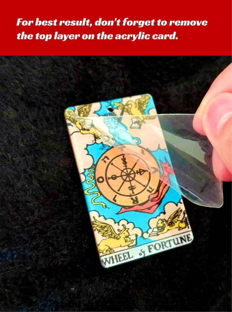 May include: A colorful tarot card with the Wheel of Fortune design. The card is made of acrylic and has a protective layer that needs to be removed for best results.