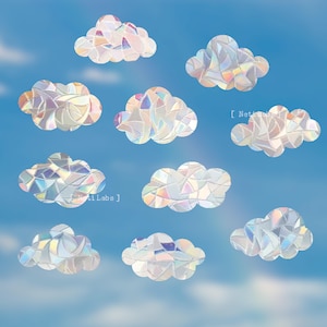 May include: Ten iridescent rainbow cloud stickers with a stained glass design. The stickers are on a blue background.