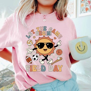 Let The Game Begin Teacher Field Day Shirt, Field Day Vibes Shirt, Field Day Fun Day Shirt, In My Field Trip Era Shirt, Field Day Squad
