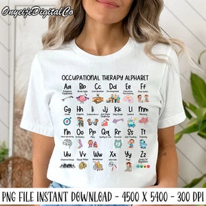 May include: White t-shirt featuring a colourful alphabet chart with occupational therapy terms and illustrations. Each letter is paired with a corresponding term and image, such as "Aa" for "Adaptive Equipment" and a picture of a wheelchair. The text "OCCUPATIONAL THERAPY ALPHABET" is at the top of the chart.