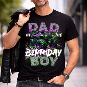 May include: Black t-shirt with a graphic of a monster truck in green and purple, with the text "DAD OF THE BIRTHDAY BOY" in a cracked stone style. The shirt is worn by a person wearing sunglasses.