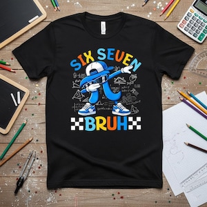 May include: Black t-shirt with a blue number seven character dabbing, wearing a white cap and sunglasses. The shirt has the words "SIX SEVEN BRUH" in blue and orange, with math symbols in the background.