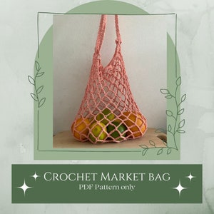 May include: A pink crocheted market bag filled with oranges and limes. The bag is hanging from a wooden surface. The text "CROCHET MARKET BAG PDF Pattern only" is displayed below the image.