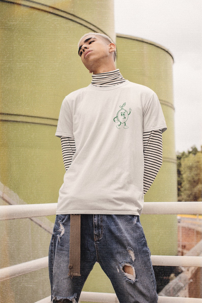 Add a touch of sunshine to your day with this Easy Peasy Lemon Squeezy t-shirt. The playful lemon graphic and lighthearted message capture the essence of summery fun. A perfect addition for any casual outfit, Salthree Shirts