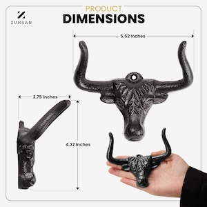May include: A black bull head wall hook with a textured finish. The product dimensions are labeled as 5.52 inches in width and 4.32 inches in height, with a side profile depth of 2.75 inches. The text ZUHSAN and PRODUCT DIMENSIONS are visible.