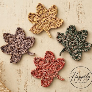 May include: Four crochet leaf appliques in yellow, dark purple, dark green, and orange, each featuring a textured, radiating stitch pattern. A circular logo in the bottom right corner contains the text Happily PATTERNS with a needle icon.