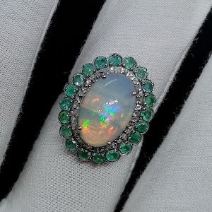 Natural Fire Opal Ring: Diamond Pave Halo, Emerald Accent, Black Band