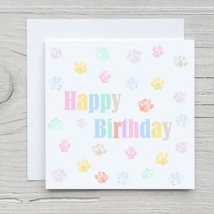Tarjeta de feliz cumpleaños colorida con huellas de acuarela. Tarjetas de cumpleaños para amantes de los animales. Bonitas y sencillas.