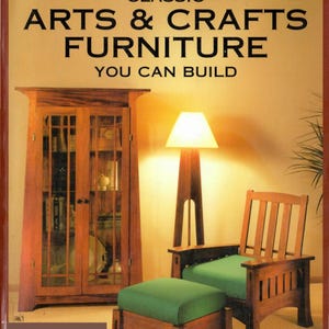May include: A book cover with the title "Classic Arts & Crafts Furniture You Can Build". The cover features a living room with a wooden cabinet, a lamp, an armchair, and an ottoman.