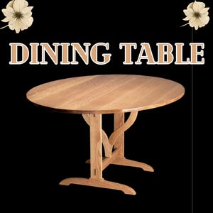 May include: A round wooden dining table with a light brown finish. The table has a unique base design with curved supports and a sturdy, wide base. The text "DINING TABLE" is displayed above the table in a decorative font.