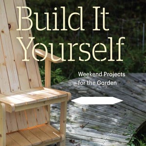 May include: A wooden Adirondack chair with the text "Build It Yourself" and "Weekend Projects for the Garden". The chair is made of light-colored wood and is on a wooden deck.