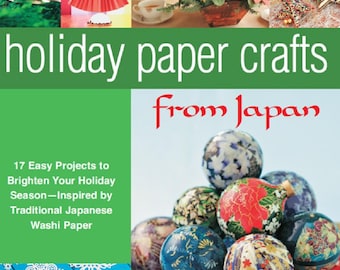 Puede incluir: Una portada de libro con el título "holiday paper crafts from Japan" y una imagen colorida de adornos y decoraciones de origami. La portada del libro también incluye el texto "17 Easy Projects to Brighten Your Holiday Season - Inspired by Traditional Japanese Washi Paper".