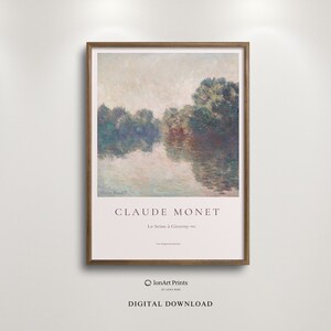 May include: A framed print of a painting by Claude Monet titled "La Seine a Giverny" depicting a river scene with trees and water in shades of blue, green, and white.