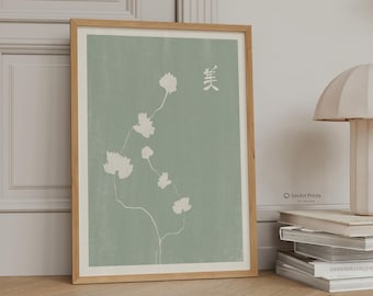 Puede incluir: Una lámina de arte enmarcada con fondo verde salvia, dibujos lineales blancos de flores delicadas y el carácter kanji japonés para la belleza. La impresión está en un marco de madera clara y muestra el texto IonArt Prints.