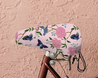 Housse de selle de vélo rose papillon fleurs sauvages, cadeau de cyclisme cottagecore ferme hippie, cadeau pour maman, cadeau de remise en forme