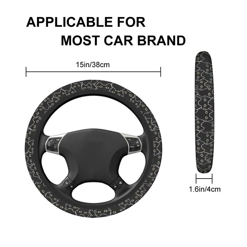 May include: Black steering wheel cover featuring a white cat design. The cover measures 38cm in diameter and is 4cm thick. The text "APPLICABLE FOR MOST CAR BRAND" is printed at the top.