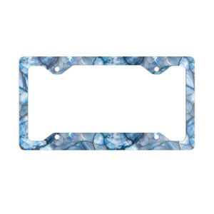 May include: A blue and white license plate frame with a marble-like pattern.