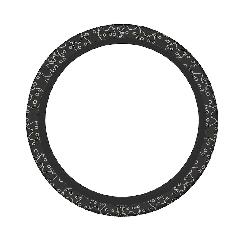 May include: A black steering wheel cover with a repeating pattern of white cat faces. The cover is circular and designed to fit around a steering wheel. The cat faces are simple line drawings, creating a playful and stylish design.