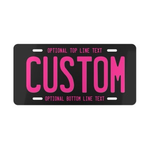 May include: Black license plate with white text that reads "OPTIONAL TOP LINE TEXT" and "OPTIONAL BOTTOM LINE TEXT". The word "CUSTOM" is in large pink letters.