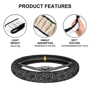 May include: Black steering wheel cover with a white cat pattern. The product features are light weight, sweat absorption, and a soft texture. The cover weighs about 55 grams.