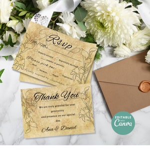 Op de afbeelding: Een vintage-stijl RSVP-kaart met een bloemenontwerp en de tekst "RSVP" in cursief. De kaart bevat opties voor gasten om hun aanwezigheid, hun keuze van maaltijd en het aantal gasten aan te geven. Een bedankkaart met de tekst "Bedankt" in cursief en de tekst "We zijn u zeer dankbaar voor uw vrijgevigheid en aanwezigheid op onze speciale dag. Ana & Daniel" is ook inbegrepen.