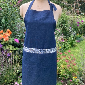 Dark denim apron with Liberty Tana Lawn floral trim and large pocket.
