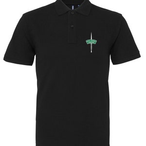 May include: Black polo shirt with an embroidered green and white patch that says "Royal Marines Commando" and a dagger.