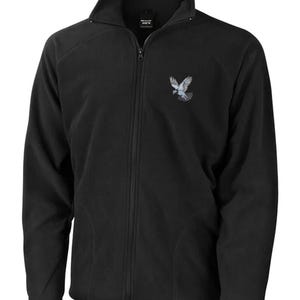 May include: Black fleece jacket with a full zip and a stand-up collar. The jacket has a small embroidered bird design on the left chest. It features two side pockets and a soft, textured appearance.