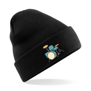 May include: Black beanie with a colourful drum set graphic. The drum set is blue, yellow and orange.