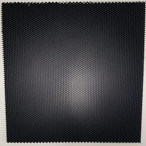 May include: A square, black honeycomb grid with a white border. The grid is made up of small, evenly spaced hexagonal cells. The texture is smooth and the overall appearance is modern and geometric.