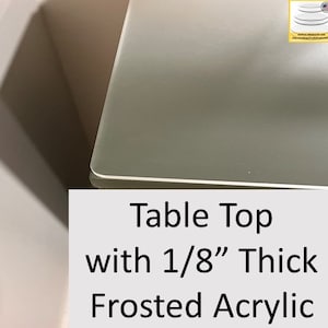 May include: A frosted acrylic table top with a thickness of 1/8 inch. The table top is white and has a smooth, matte finish.