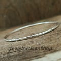Hammered 925 Sterling Silver Bangle – Thin Stackable Silver Bracelet-Handmade Minimalist Stackable Jewelry-Dainty Textured Bangle for Women product logo