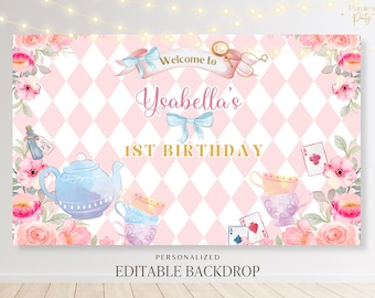 May include: A pink and white checkered backdrop with a teacup and teapot design. The backdrop features a gold inscription that reads "Welcome to Ysabella's 1st Birthday". The backdrop is decorated with pink and white flowers and a playing card.