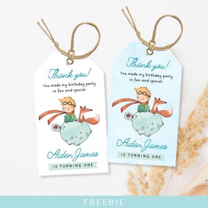 May include: Two printable thank you tags featuring a watercolor illustration of the Little Prince and his fox on a planet. The text on the tags reads "Thank you! You made my birthday party so fun and special." and "Aiden James is turning one."