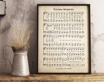 May include: A black framed print of sheet music with the title "Precious Memories". The music is for a song with lyrics and music by J.B.J. Wright. The sheet music is printed on cream-colored paper.