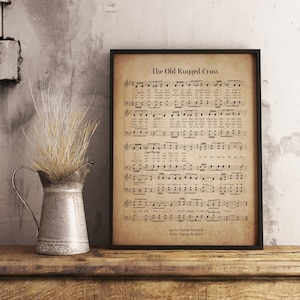May include: A vintage-style print of a hymn sheet with the title "The Old Rugged Cross". The sheet music features musical notes and lyrics for the song. The lyrics include the lines "On a far off hill, a-way, stood an old rugged cross... And I love that old cross, where the dear dying Lamb..."