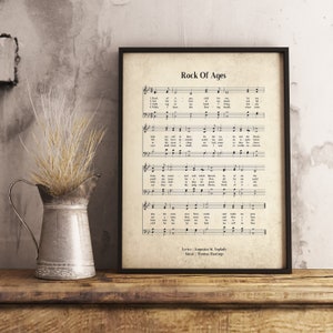 May include: A vintage-style printable featuring the hymn "Rock of Ages" with sheet music and lyrics. The lyrics are by Augustus M. Toplady and the music is by Thomas Hastings.
