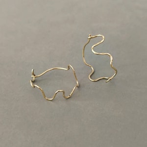 14k laminated gold snake hoop earrings image 1