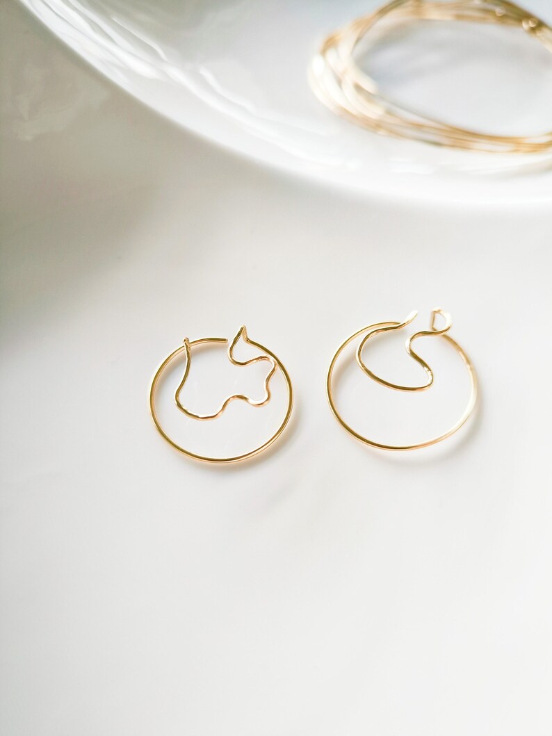 14k laminated gold snake hoop earrings image 1